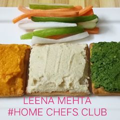 A picture of Hummus three ways with cracker.
