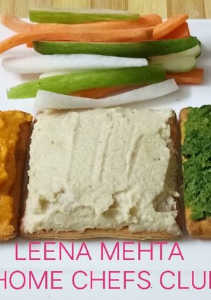 A picture of Hummus three ways with cracker.