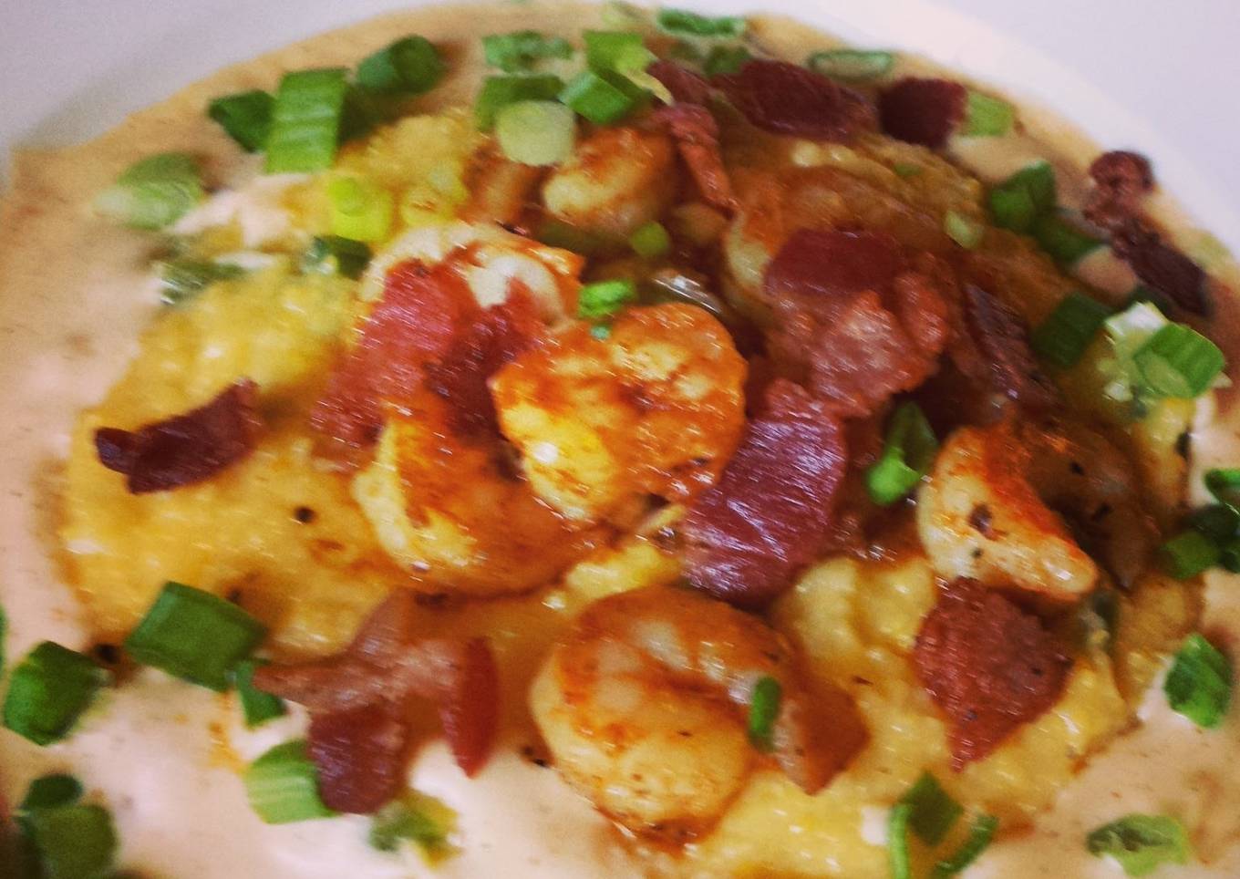 Shrimp & Cheddar Jalapeño Grits with Cajun cream sauce