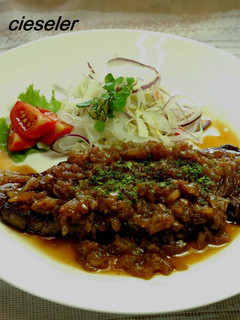 A picture of Beef Steak with Onion Sauce.