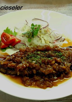 A picture of Beef Steak with Onion Sauce.