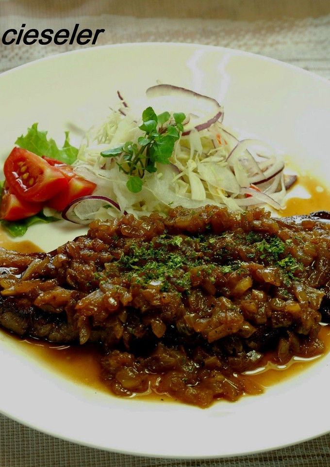 A picture of Beef Steak with Onion Sauce.