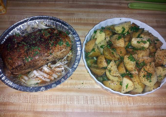 pork roast tenderloin with roasted potatoes and corn on the cob