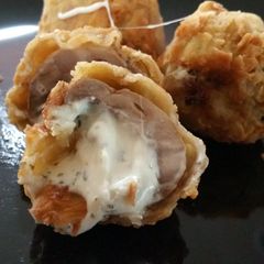 A picture of Garlic cheese stuffed shrooms.