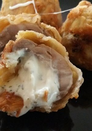 A picture of Garlic cheese stuffed shrooms.