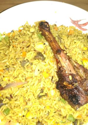 A picture of Fried rice with gezzard and chicken.