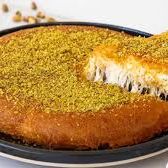 A picture of Knafeh (sweet cheese pastry).