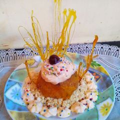 A picture of CREAMY -PAPAYA -PANEER DESSERT with sugar garnishing.