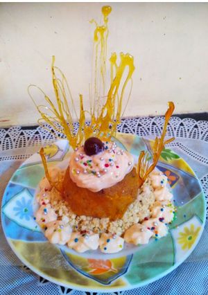 A picture of CREAMY -PAPAYA -PANEER DESSERT with sugar garnishing.