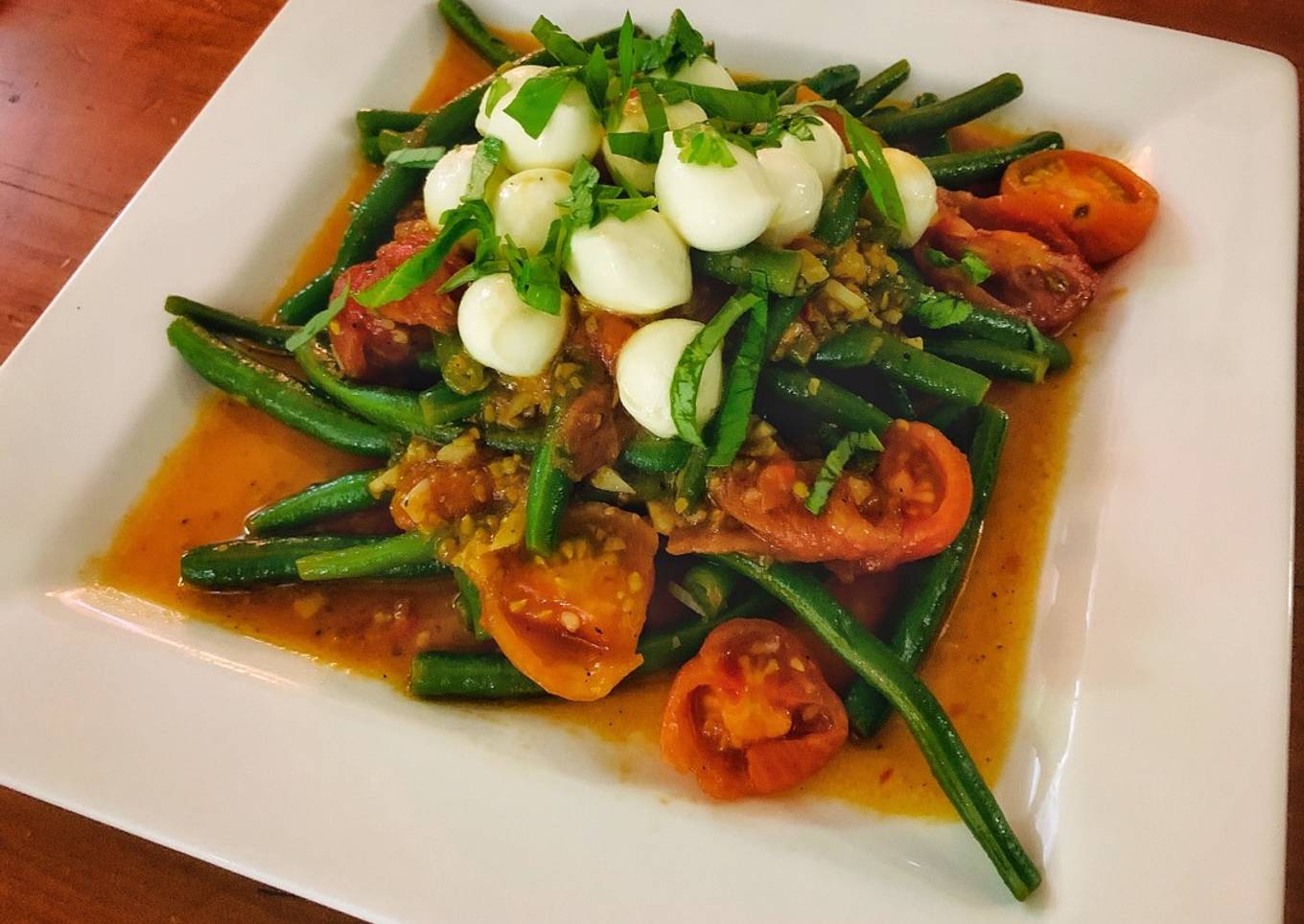 Angry bean salad with warm arrabbiata dressing, chilled baby mozzarella and fresh mint