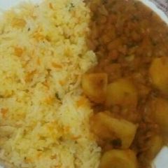 A picture of Fried rice with mashed beans mixed with Irish potatoes.