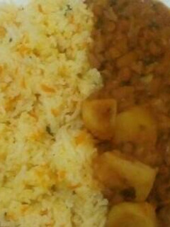A picture of Fried rice with mashed beans mixed with Irish potatoes.