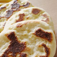 A picture of Light and Puffy Homemade Naan Bread in a Pan.