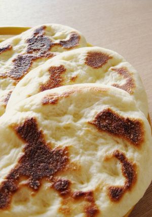 A picture of Light and Puffy Homemade Naan Bread in a Pan.