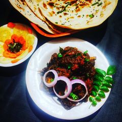 Mangalorean style ghee roast chicken A picture of Mangalorean style ghee roast chicken.