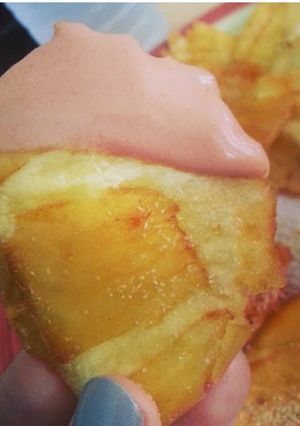 A picture of Fried Breadfruit (Tostones de pana) with "Fancy Sauce" (Mayo/ketchup).