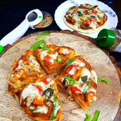 Paneer Tikka Cheese Burst Pizza, without oven A picture of Paneer Tikka Cheese Burst Pizza, without oven.