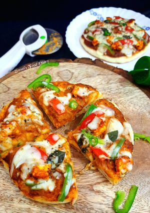 A picture of Paneer Tikka Cheese Burst Pizza, without oven.
