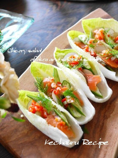 A picture of Salmon & Okra on an Endive Boat with Paprika Salsa.