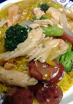 A picture of chicken and sausage in duck sauce.