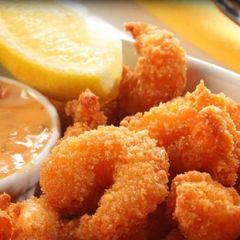 A picture of Coconut shrimp with mango sauce.