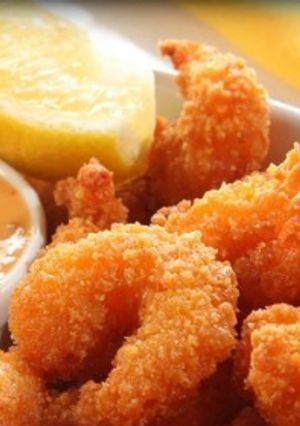 A picture of Coconut shrimp with mango sauce.