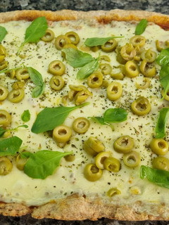 Una foto de Pizza de masa integral