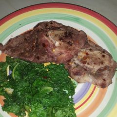 A picture of Lamb and kale.