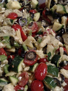 A picture of Artichoke and tomato basil salad.