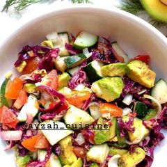 A picture of Cucumber, tomato and avocado salad.
