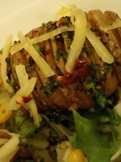 A picture of Hasselback Potatoes Served with garden fresh salad.