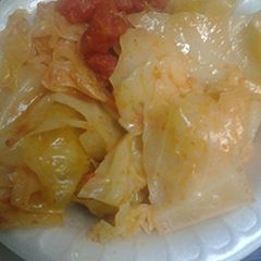 A picture of Stewed cabbage and tomatoes.