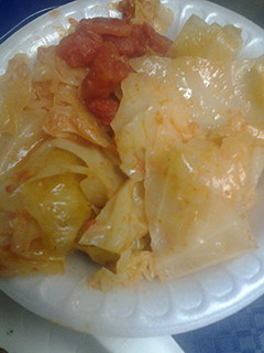 A picture of Stewed cabbage and tomatoes.