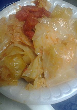 A picture of Stewed cabbage and tomatoes.