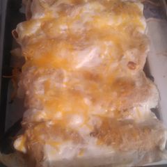 A picture of Salsa Verde chicken enchiladas.