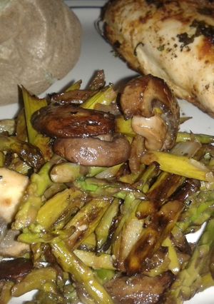 A picture of Sauteed Asparagus with mushrooms and onions.