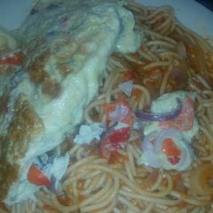 A picture of Pasta with fried egg.