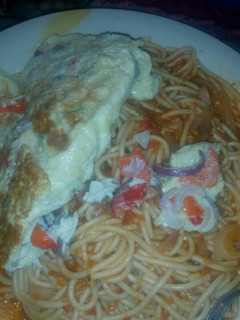 A picture of Pasta with fried egg.