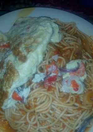 A picture of Pasta with fried egg.