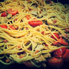 A picture of Spaghetti with Smocked Ham, tomatoes and meat.