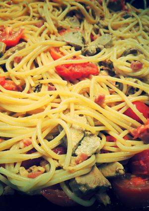 A picture of Spaghetti with Smocked Ham, tomatoes and meat.