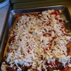 A picture of Meatball parmsean pizza.
