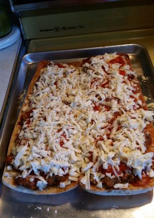 A picture of Meatball parmsean pizza.