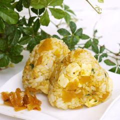A picture of Rice Ball with Curry and Cheese.