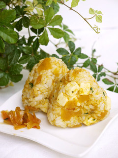 A picture of Rice Ball with Curry and Cheese.