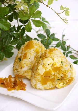 A picture of Rice Ball with Curry and Cheese.