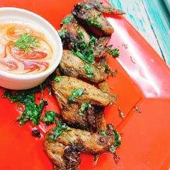 A picture of Garlic chicken wings with paramesan cheese in airfryer.
