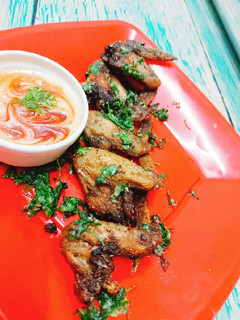 A picture of Garlic chicken wings with paramesan cheese in airfryer.