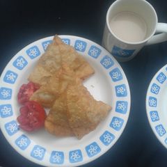 Samosa with tea A picture of Samosa with tea.