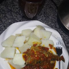 A picture of Boiled yam n sauce with tamarind drink.